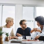 diverse group of businesspeople sitting together and having a meeting