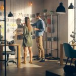 Man and women organizing video strategy mood board in office