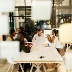 Group of professional office workers around a table