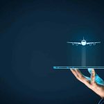 Hand holding tablet with airplane floating above aviation marketing